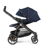 Load image into Gallery viewer, Peg Perego Book SLK Modular 3 in 1 travel system - Includes infant car seat, bassinet, toddler seat, nappy bag, and foot muff. Maneuverable on various surfaces. Available in South Africa with CB Baby.
