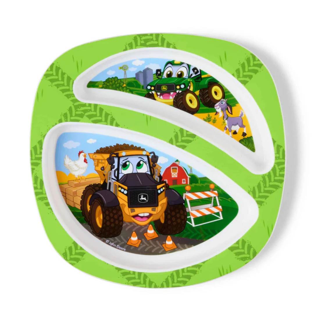 Children's plate with cartoon tractors and farm scenes on a green background